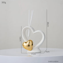 Load image into Gallery viewer, Luxurious Gold heart shaped Statue Romantic Aroma Lamp